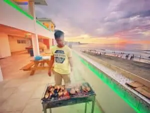 barbecue being prepared on the outside dining area of the escape hotel
