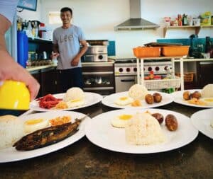 rice and fish served for breakfast in the kitchen of the escape san juan